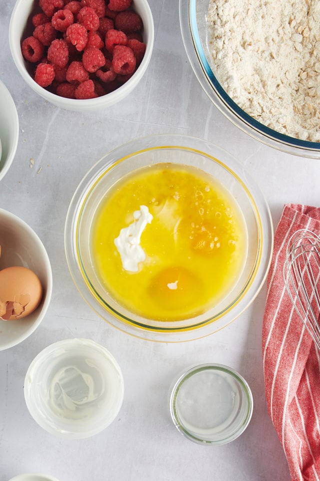 Wet ingredients for muffins in bowl before stirring