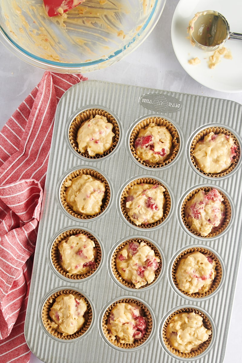 Raspberry oat muffin batter in pan