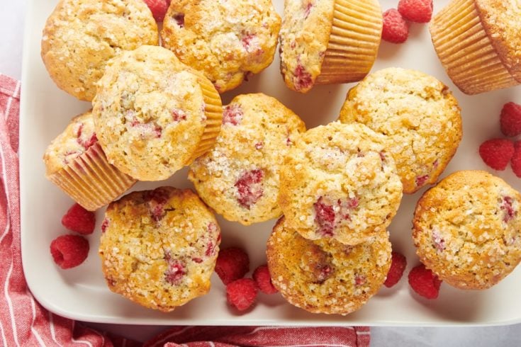 Overhead view of raspberry oat muffins stacked on tray