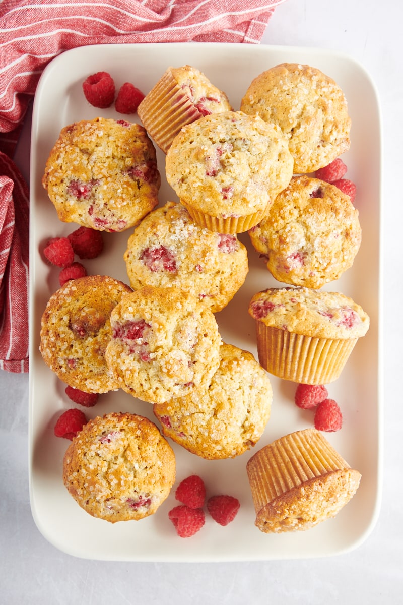 Overhead view of raspberry oat muffins stacked on tray