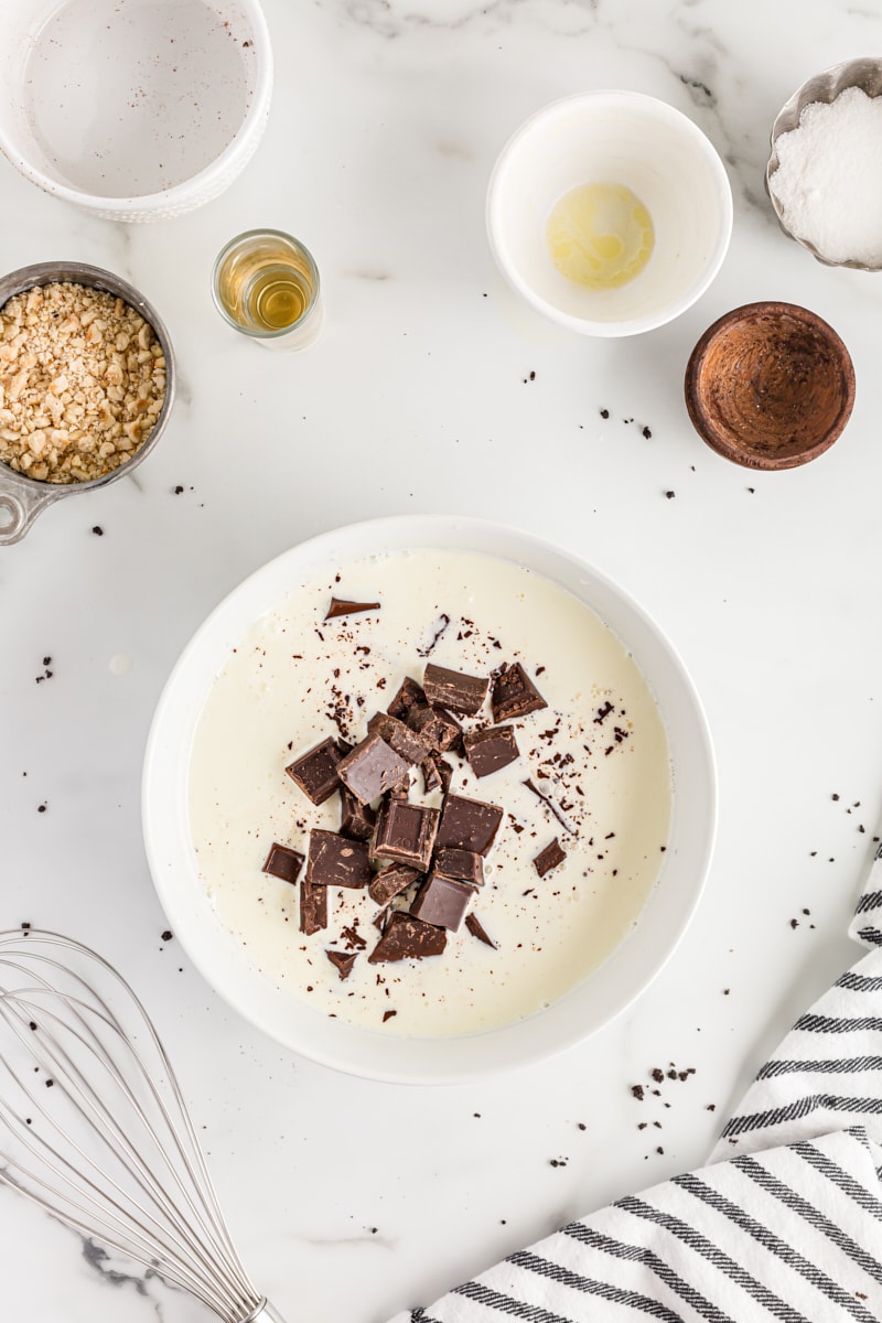 Overhead view of chocolate and cream in bowl