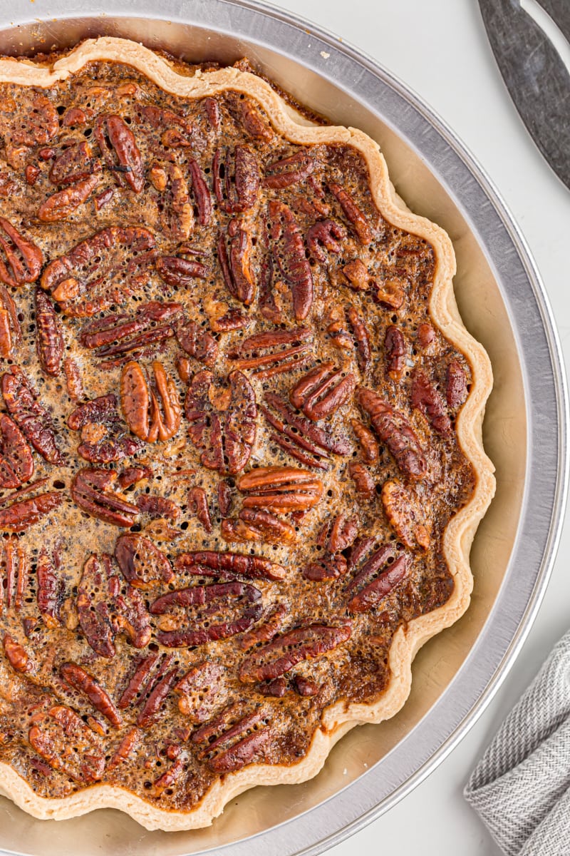 Overhead view of a baked whole pecan pie.