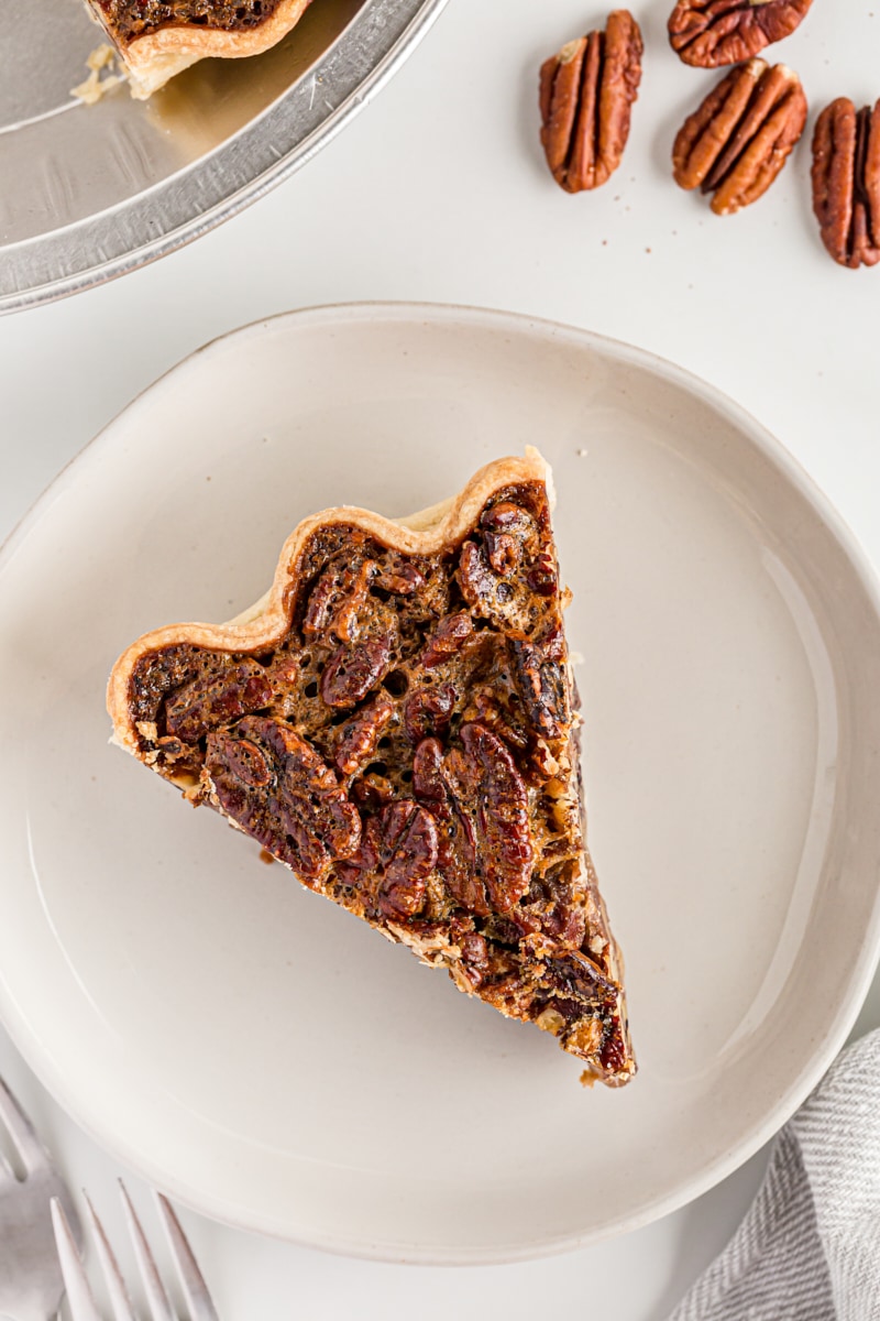 Overhead view of pecan pie slice on plate