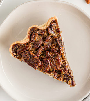 Overhead view of pecan pie slice on plate
