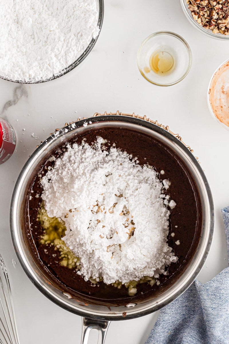 Powdered sugar added to Coca-Cola Cake frosting