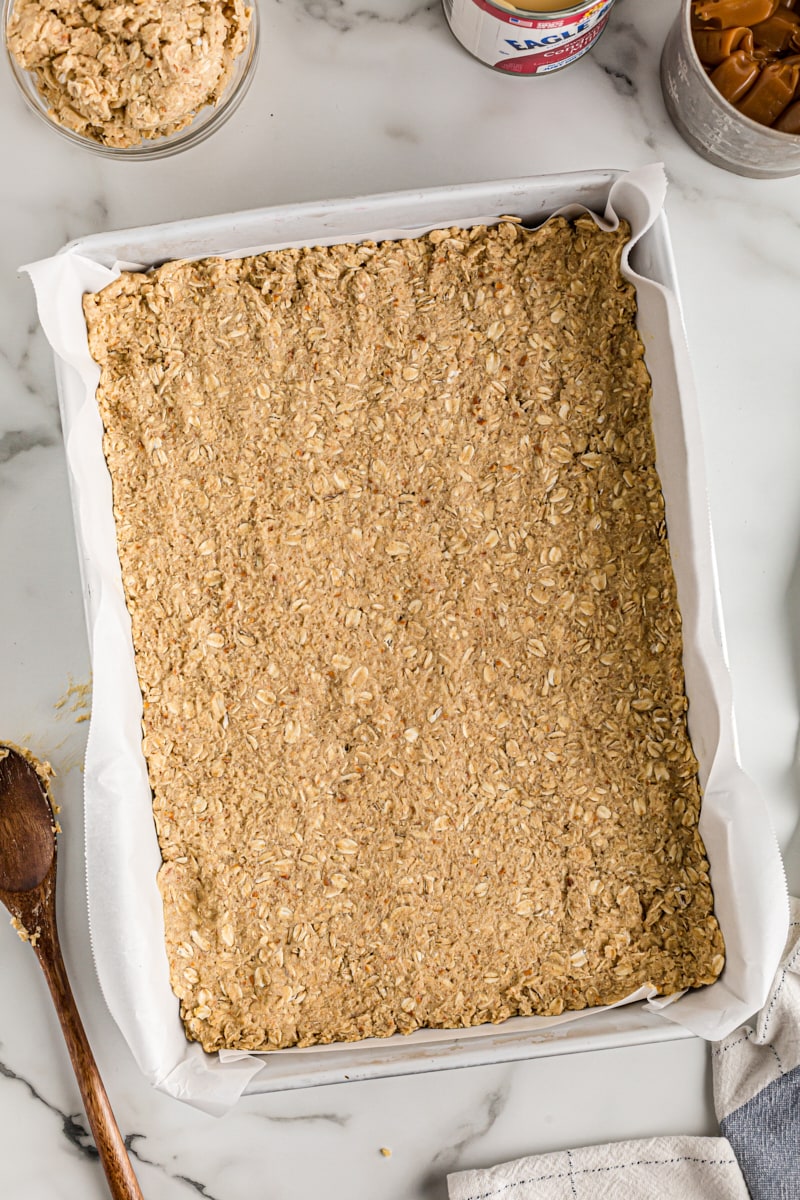 Crust for salty cashew caramel bars in pan