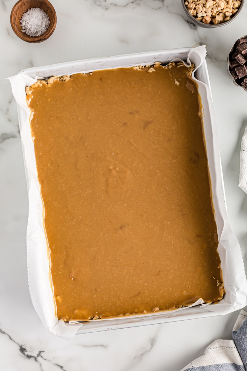 Overhead view of caramel layer of salty cashew caramel bars