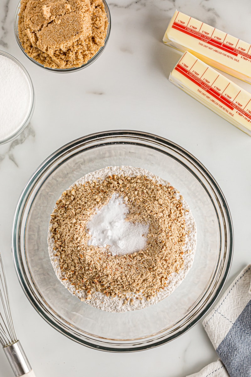 Dry ingredients for crust in glass mixing bowl