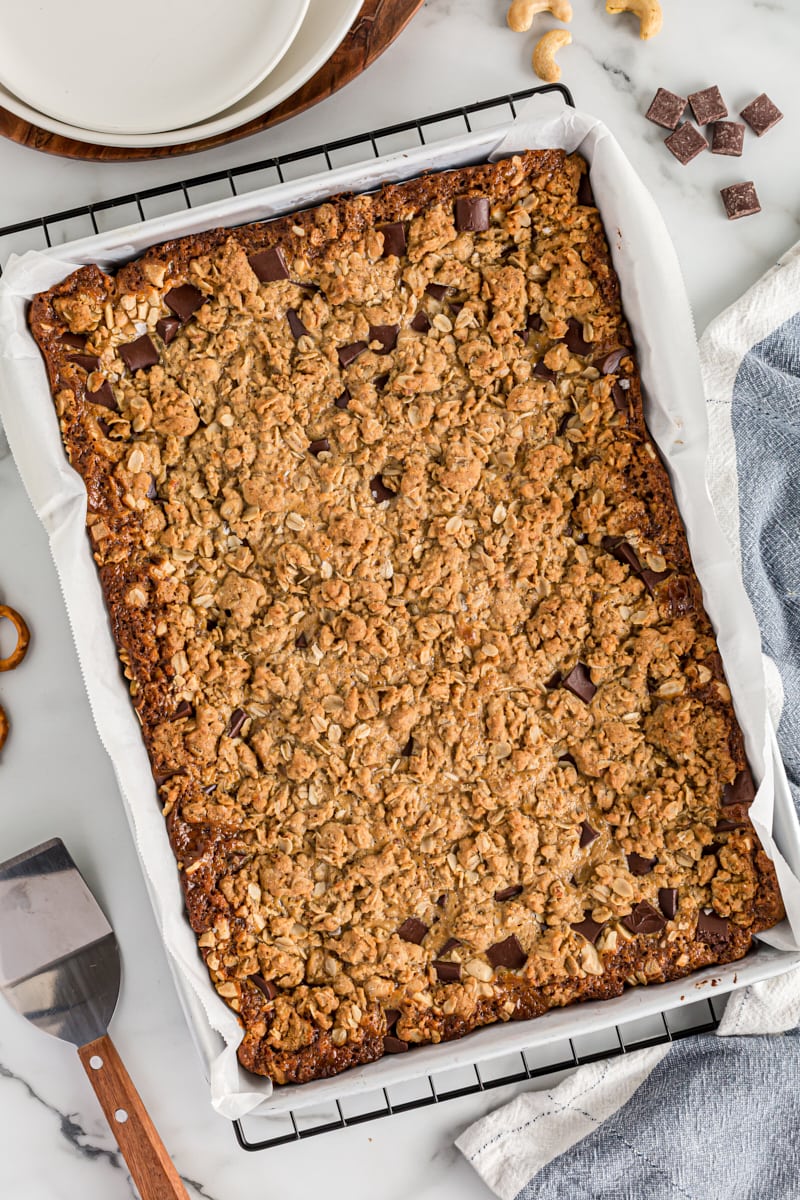 Overhead view of salty cashew caramel bars in pan