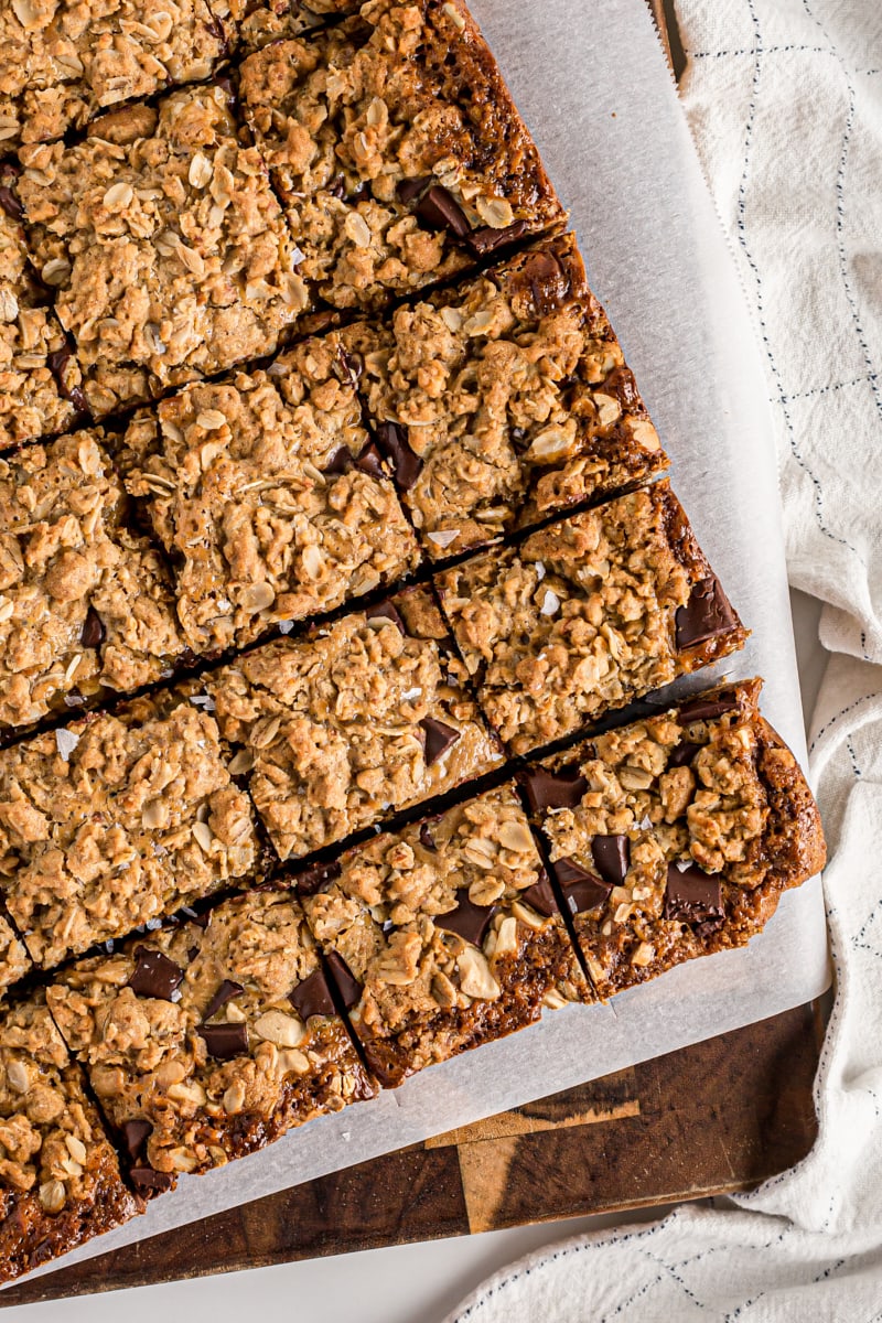 Overhead view of salty cashew caramel bars on parchment