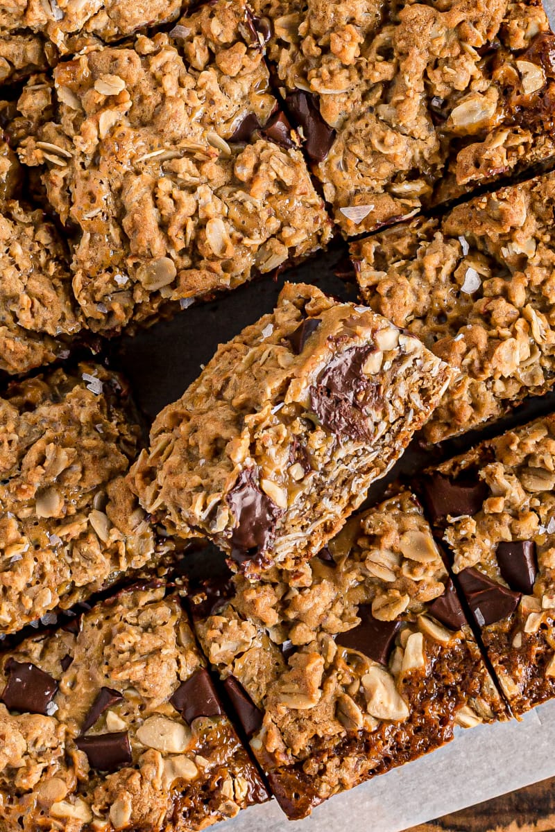 salty cashew caramel bars on parchment paper