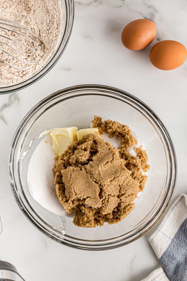 Ingredients for crust in glass mixing bowl