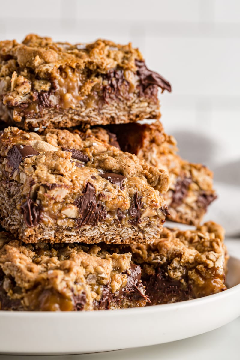 Stack of salty cashew caramel bars on plate