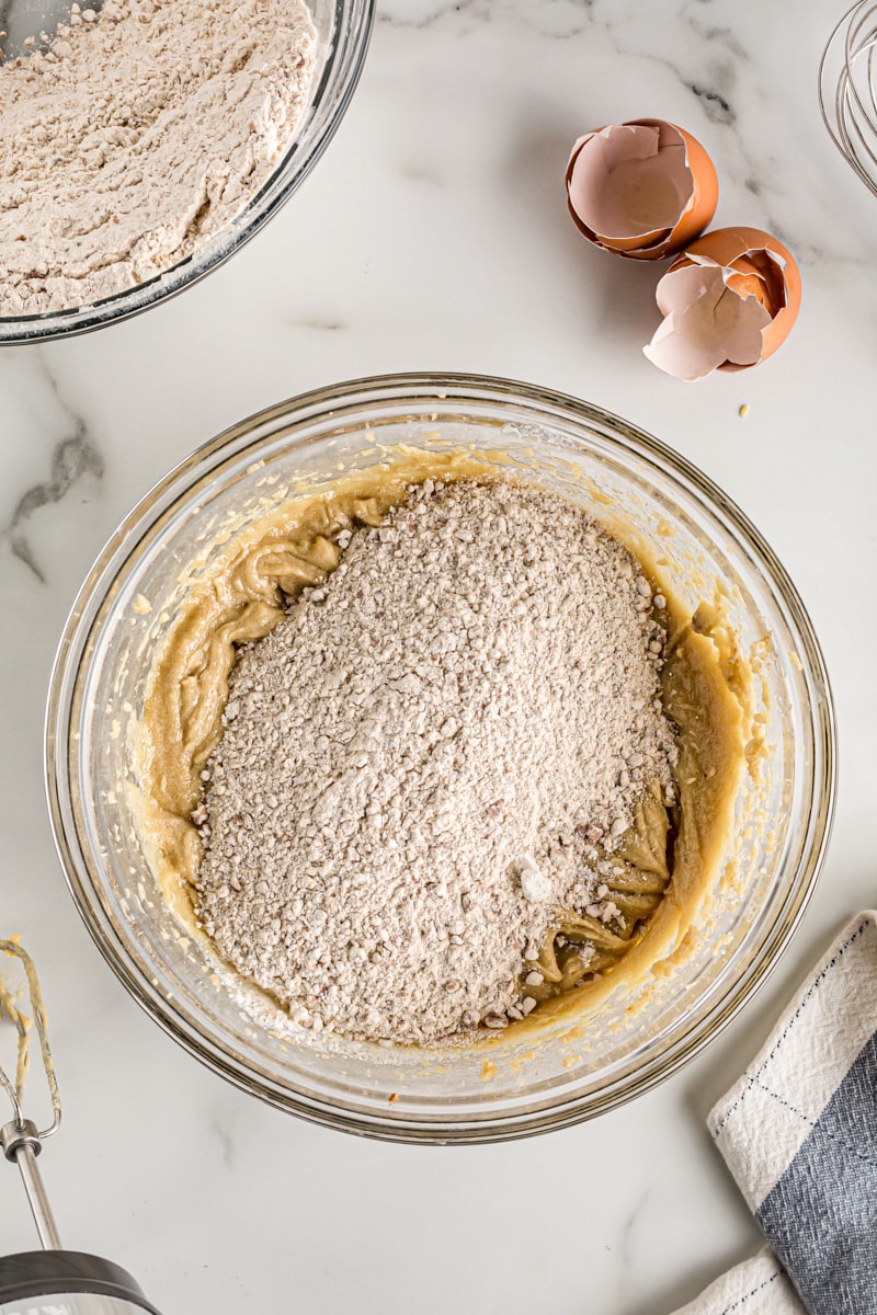 Adding dry ingredients to glass mixing bowl