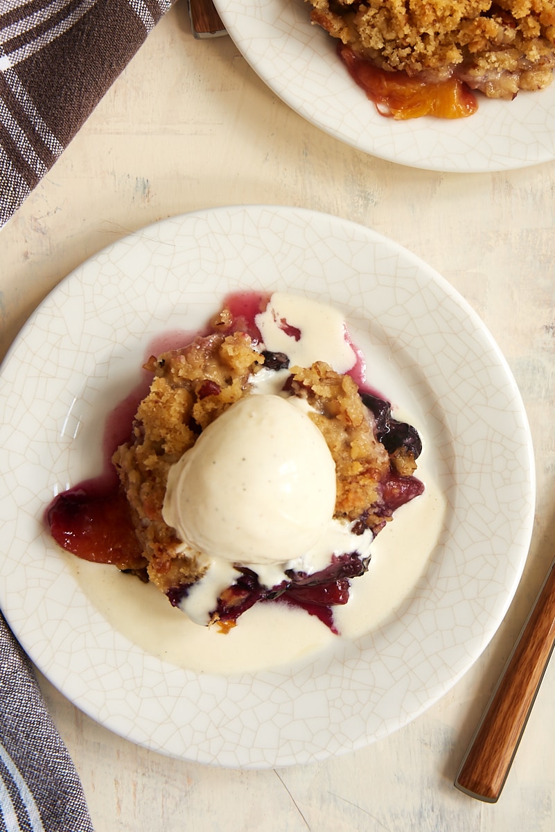 Blueberry Peach Crisp topped with vanilla ice cream