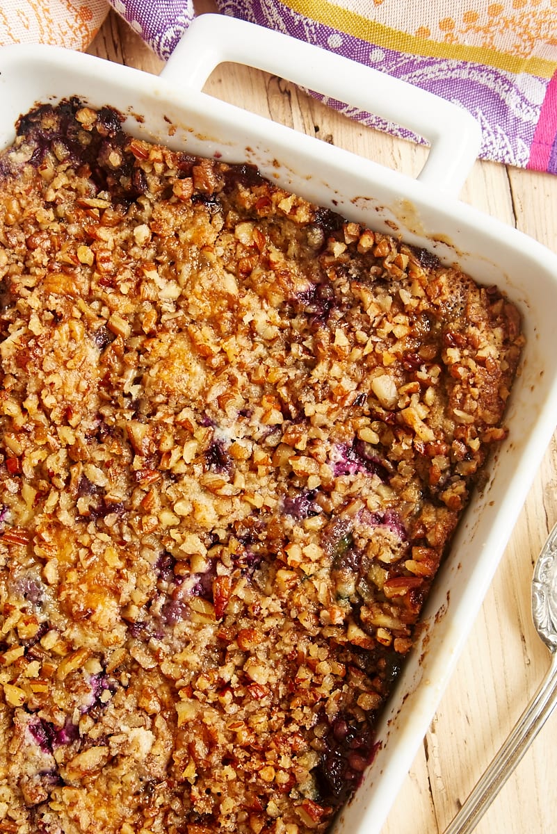 Overhead view of Blueberry Pineapple Dump Cake in a white baking pan.