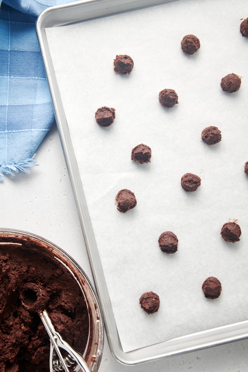 Chocolate cookie dough on parchment-lined baking sheet