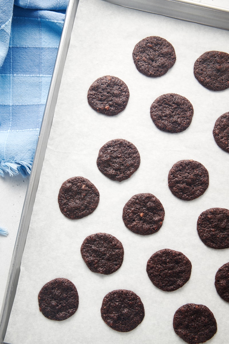 Chewy chocolate cookies on parchment lined baking sheet