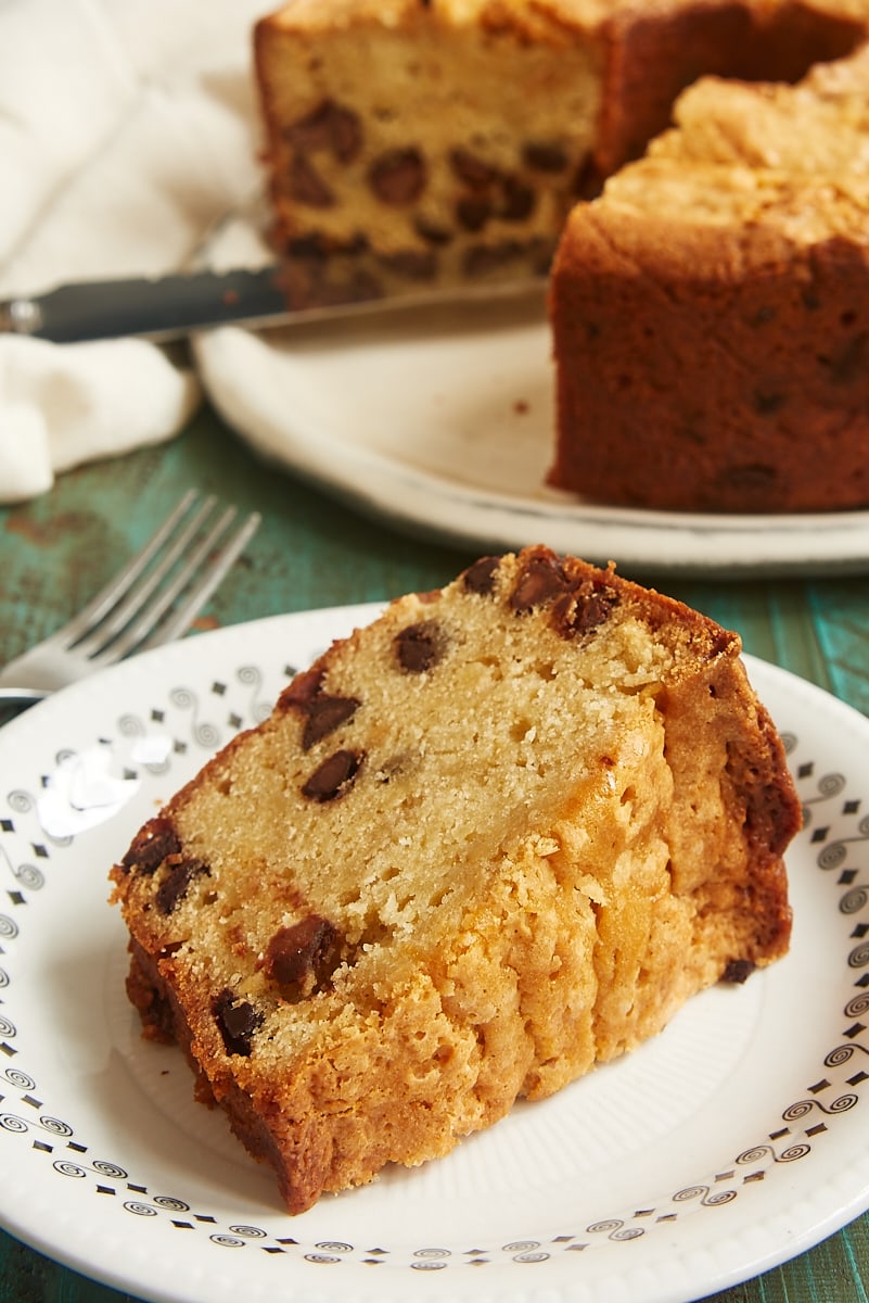 slice of Chocolate Chip Cream Cheese Pound Cake on a black-rimmed white plate