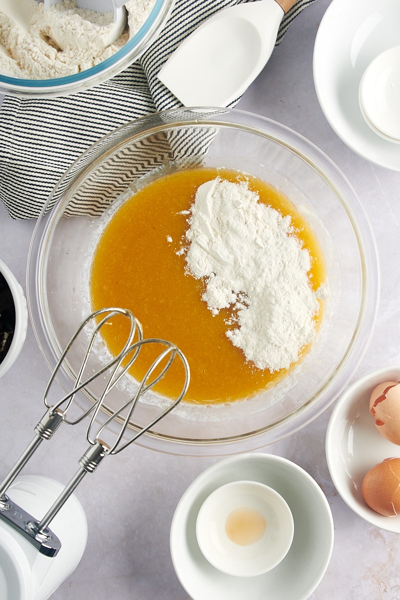 overhead view of flour added to Cookies and Cream Blondies batter