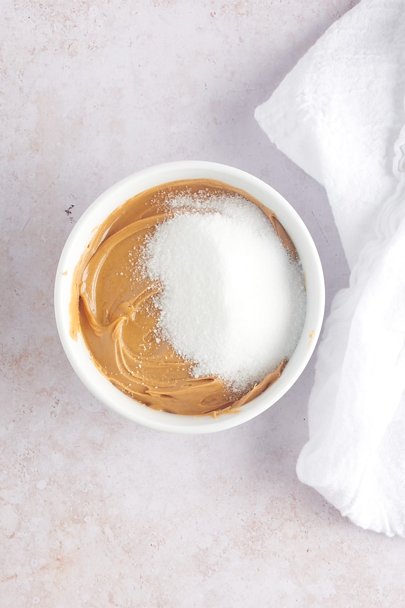 Overhead view of peanut butter and sugar in bowl