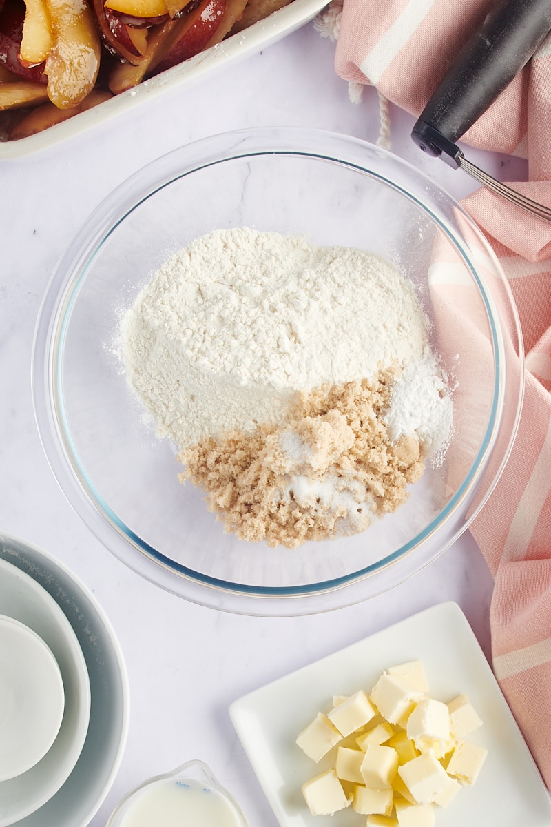 overhead view of cobbler topping ingredients in a glass mixing bowl