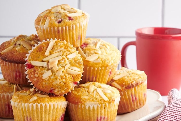 Red Currant Muffins piled on a white plate