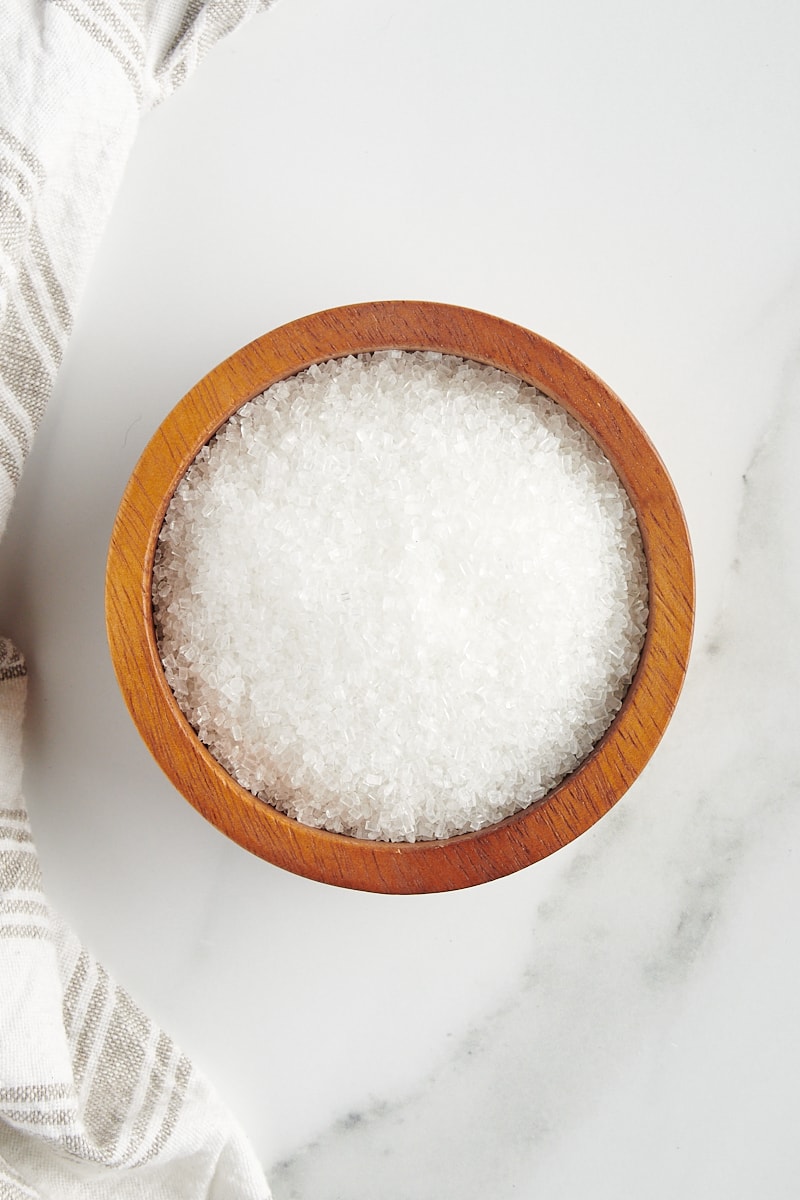 overhead view of sanding sugar in a small wooden bowl