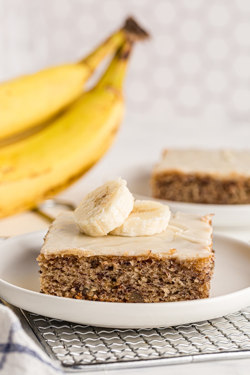 Banana bar topped with sliced bananas on plate