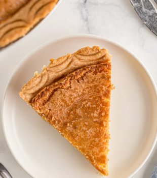 Overhead view of slice of chess pie on plate