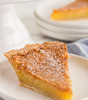 Slice of chess pie on plate