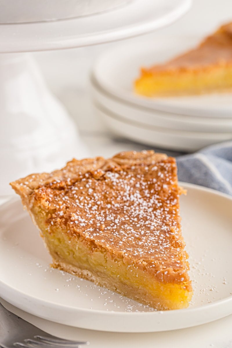 Slice of chess pie on plate