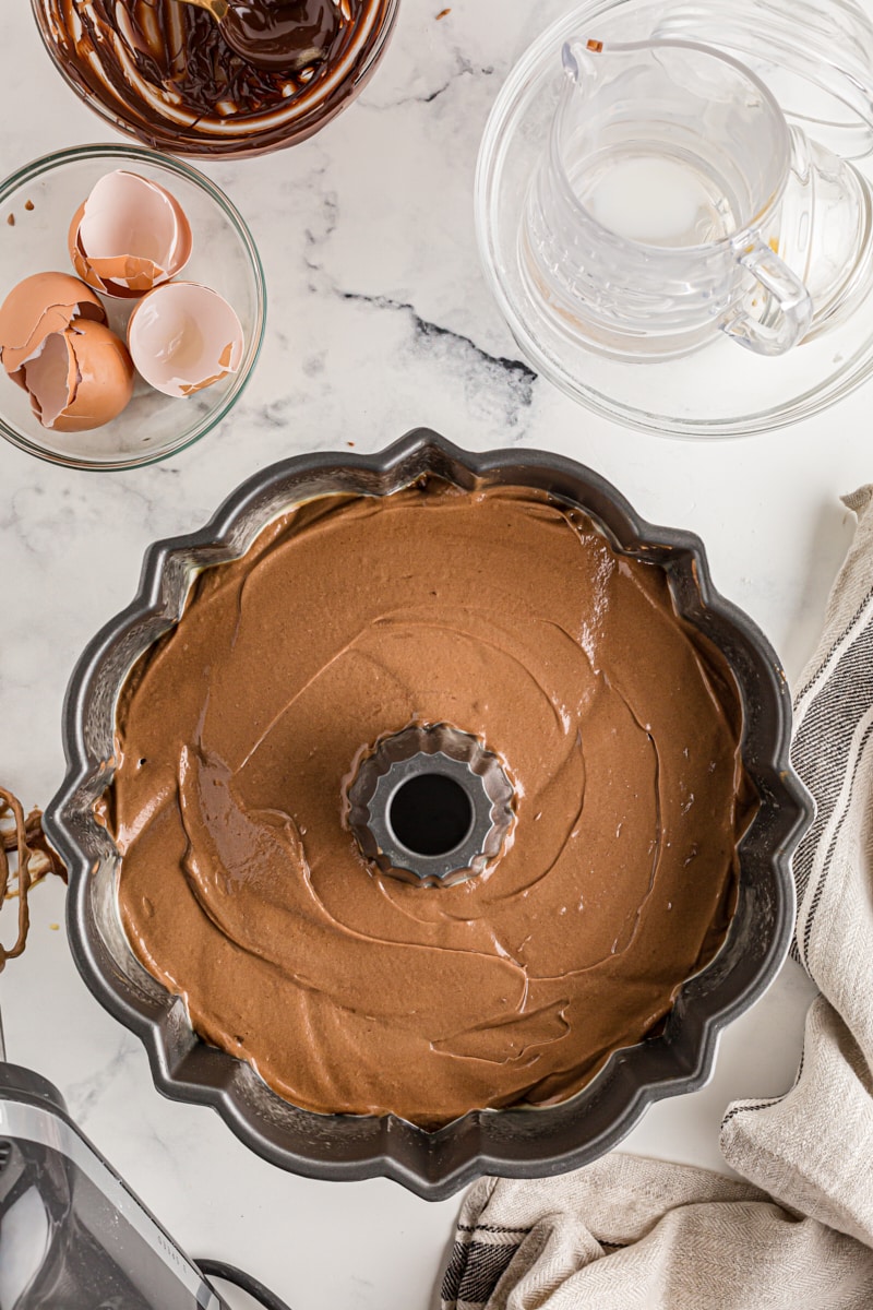 Overhead view of chocolate amaretto bundt cake batter in pan