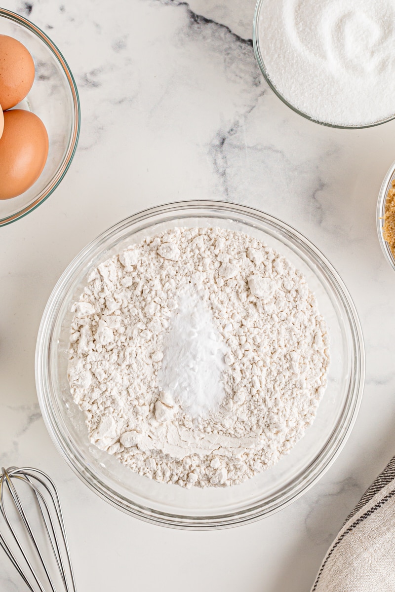 Overhead view of dry cake ingredients in mixing bowl