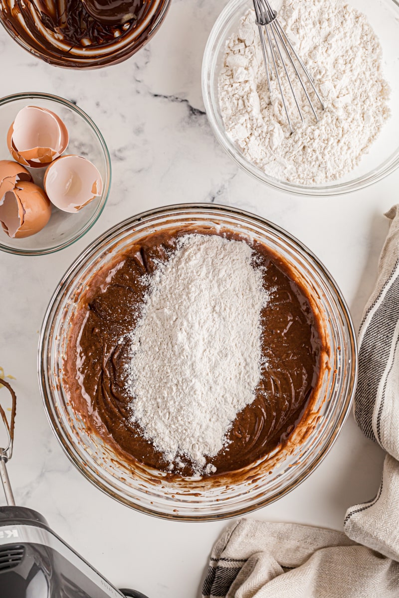 Overhead view of flour added to cake batter