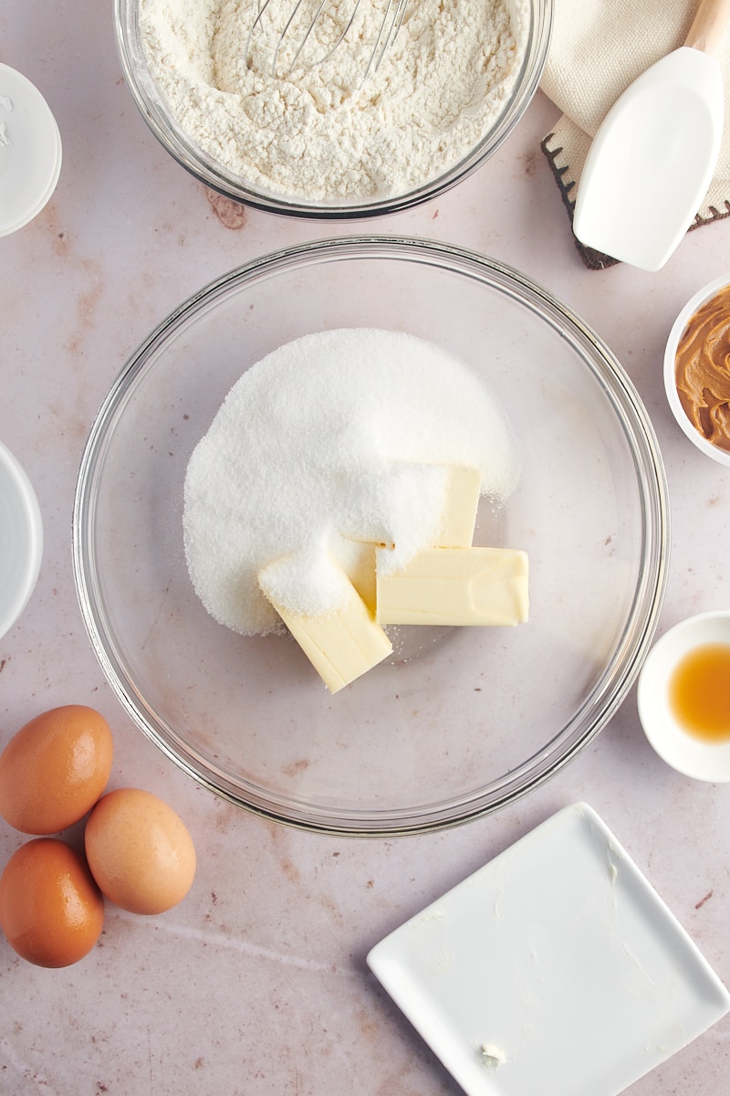 Overhead view of butter and sugar in mixing bowl