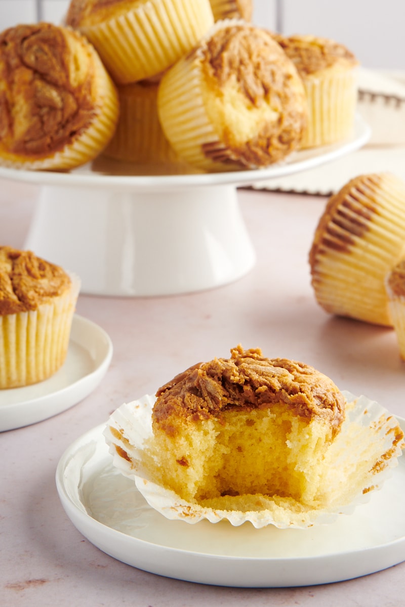 Biscoff cupcake with bite taken out on plate