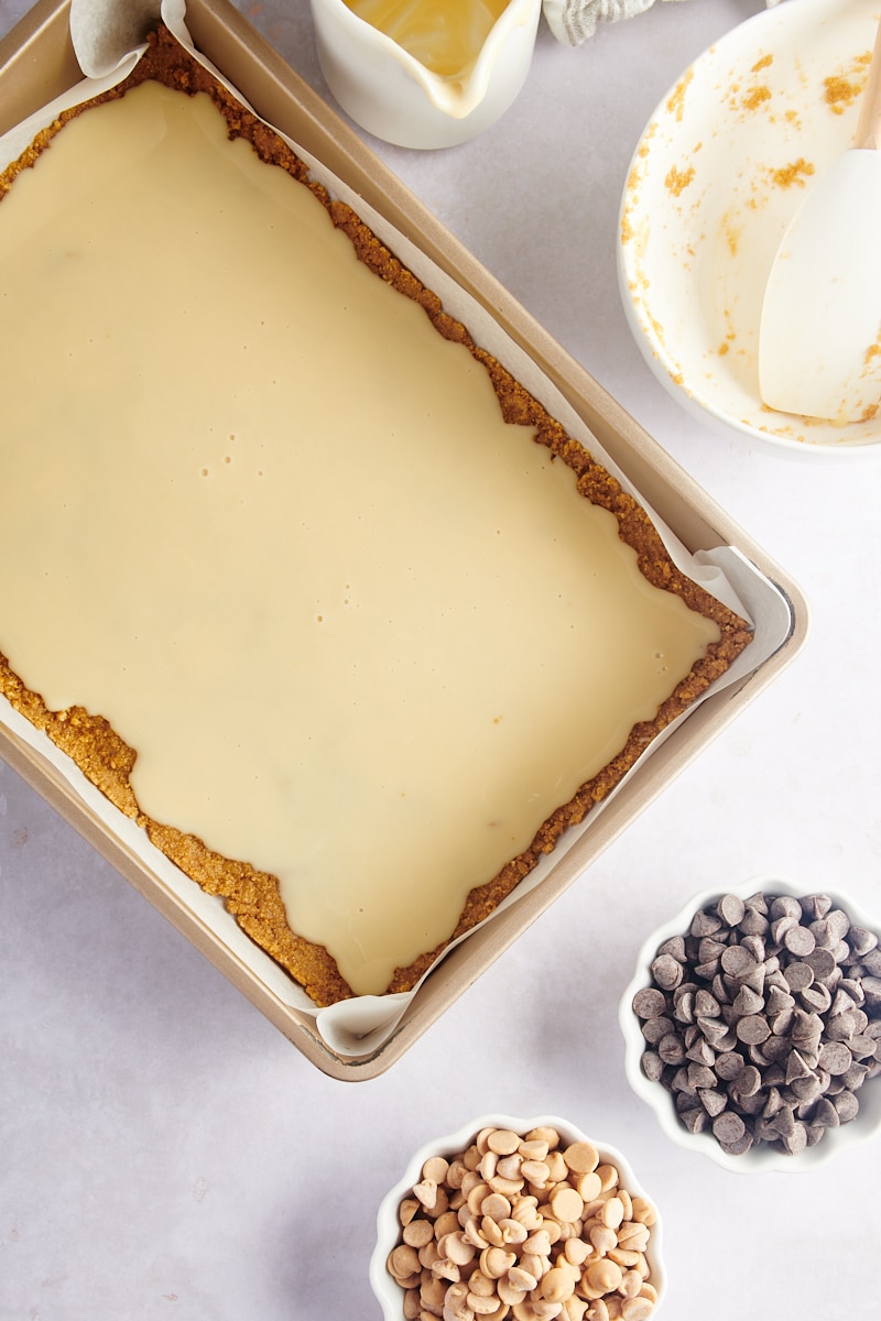 Overhead view of unbaked cookie bars before adding chip topping