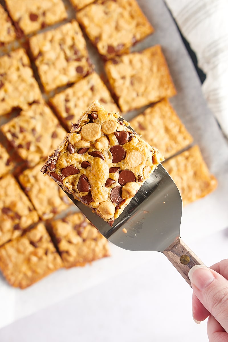 Spatula holding cookie bar over pan