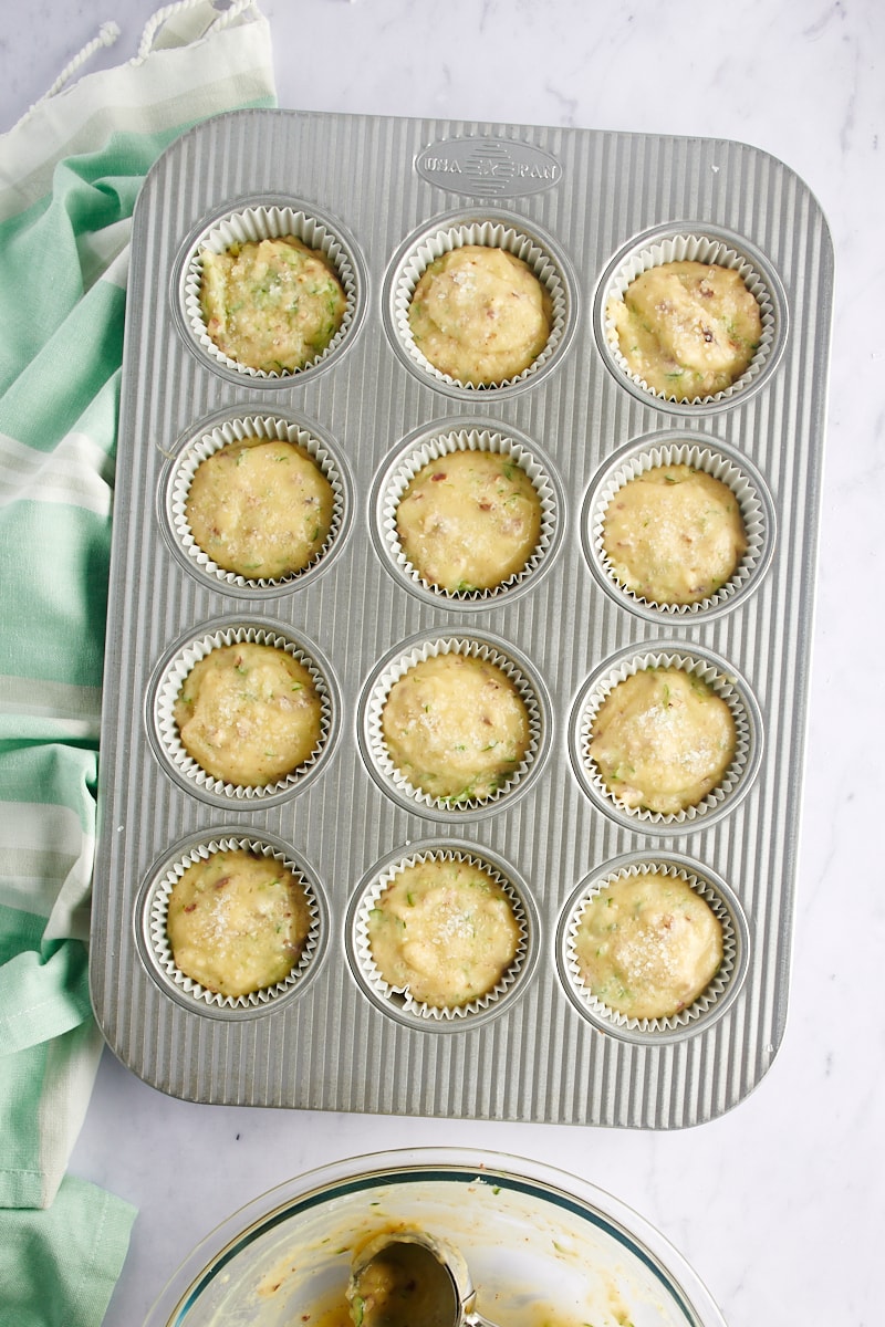 overhead view of Lemon Zucchini Muffins batter in a muffin pan