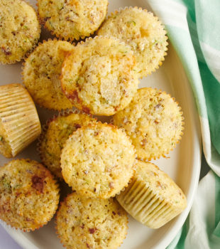 overhead view of Lemon Zucchini Muffins on an oval white tray