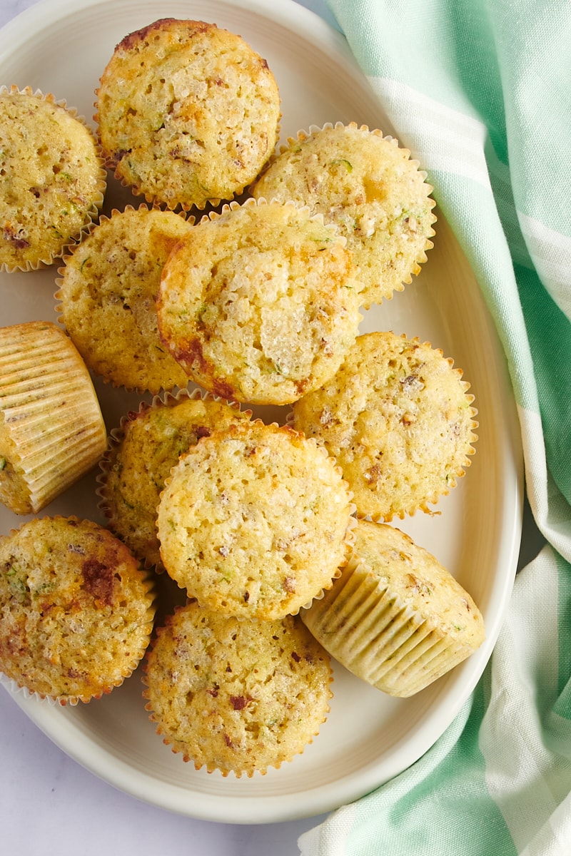 overhead view of Lemon Zucchini Muffins on an oval white tray