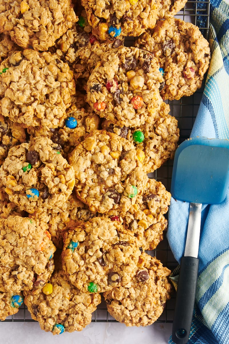 Overhead view of monster cookies on cooling rack