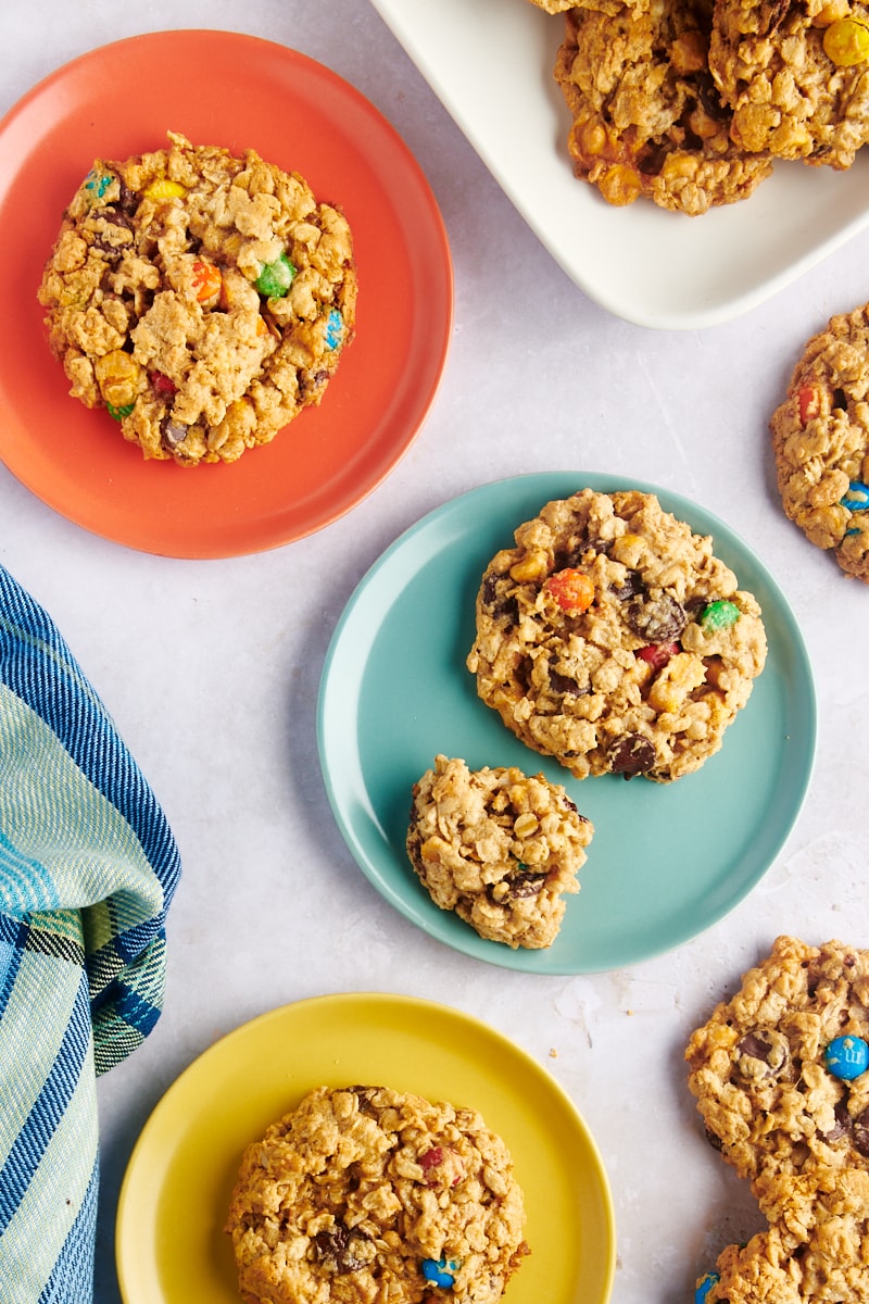 Overhead view of monster cookies on 3 plates.