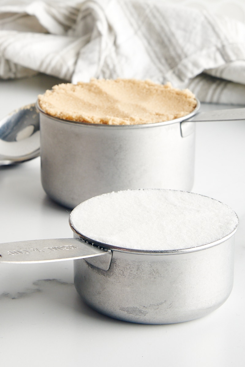 baking ingredients measured in metal measuring cups