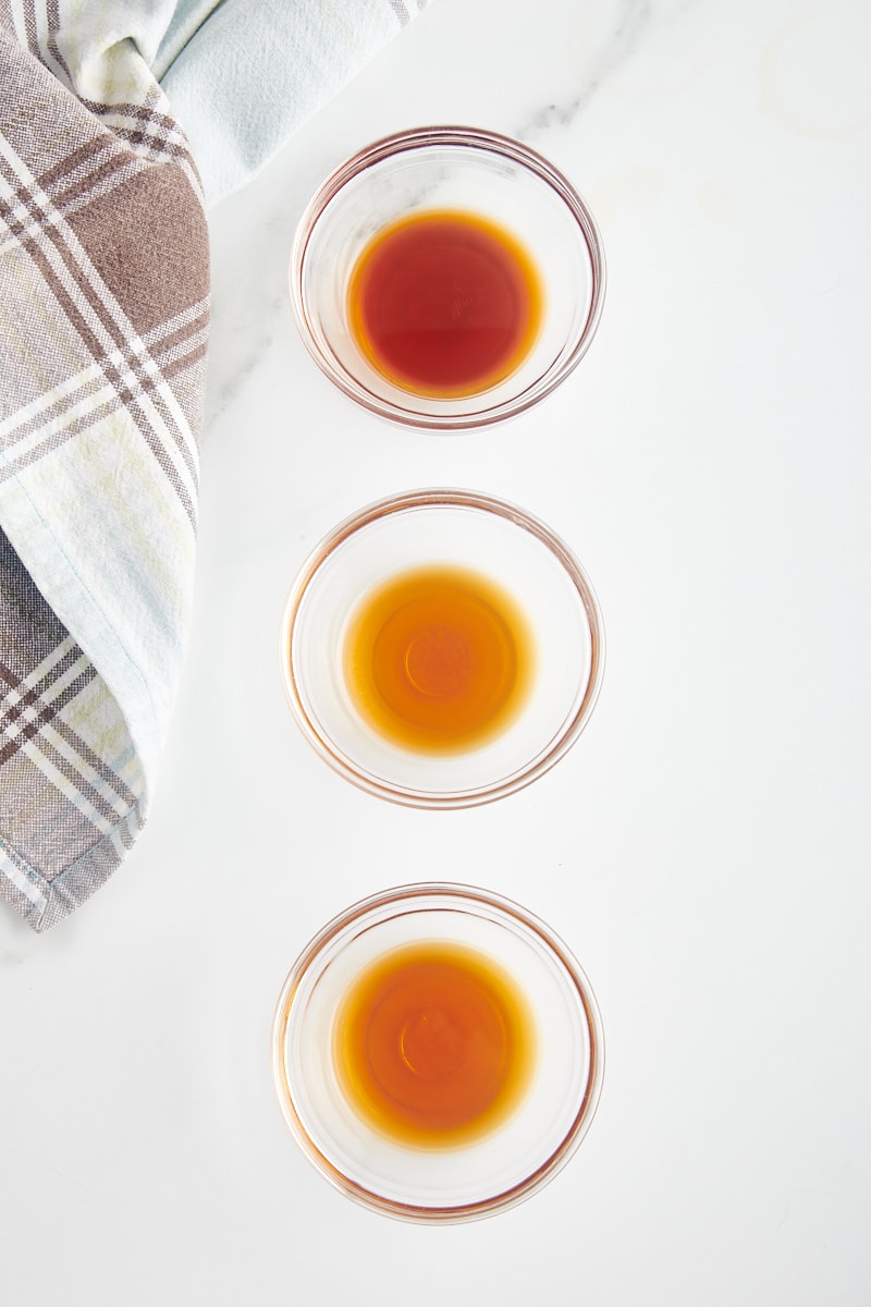 overhead view of Madagascar, Mexican, and Tahitian vanilla in glass bowls