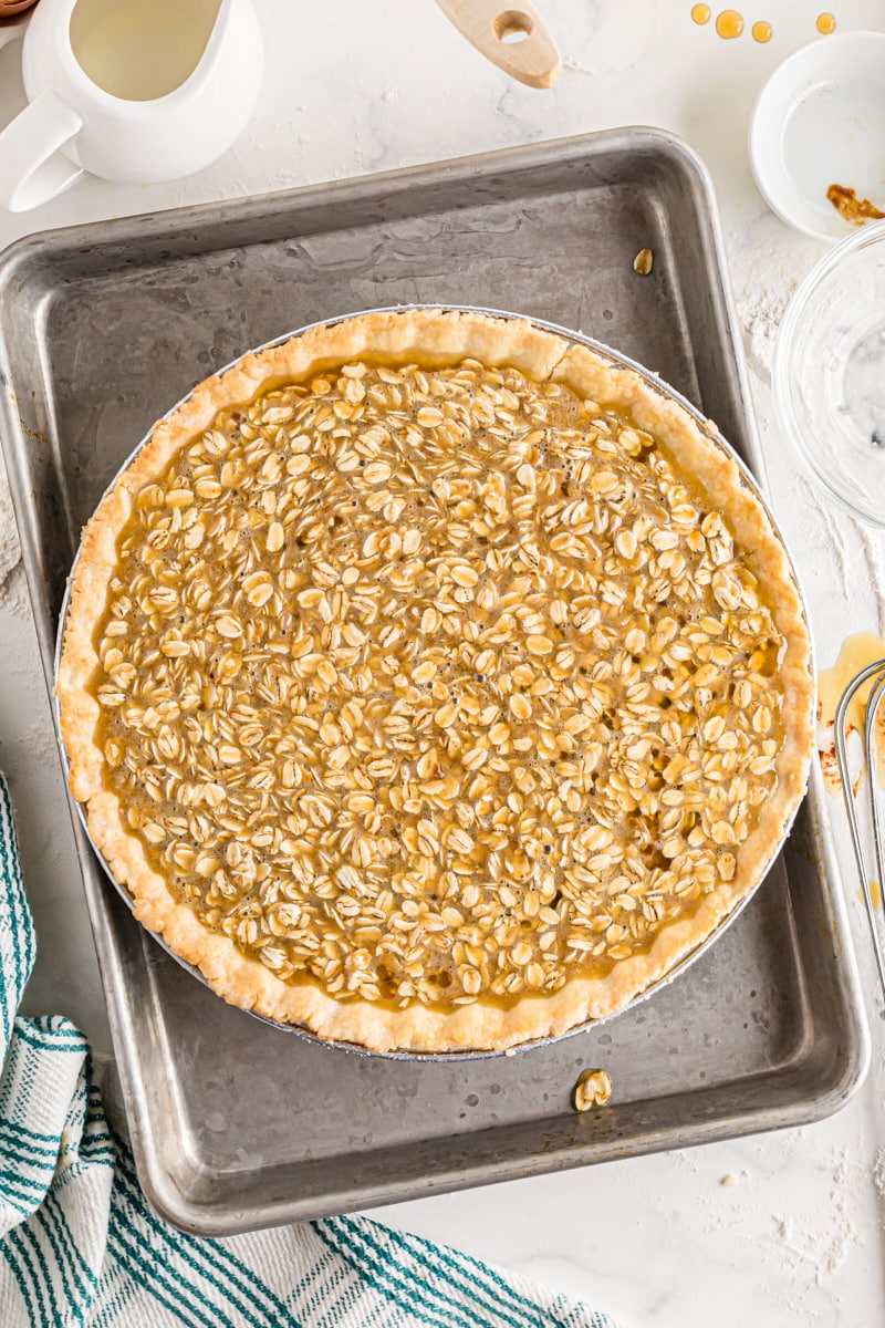 A pie crust filled with oatmeal pie filling that hides the chocolate ganache.