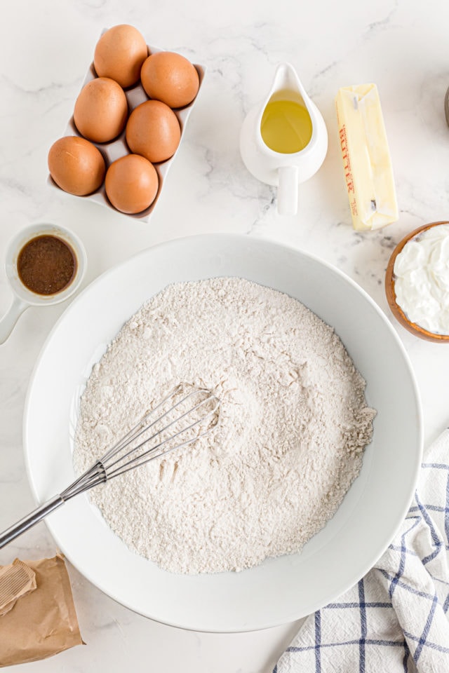 The dry ingredients for Cinnamon Roll Cake being whisked together.