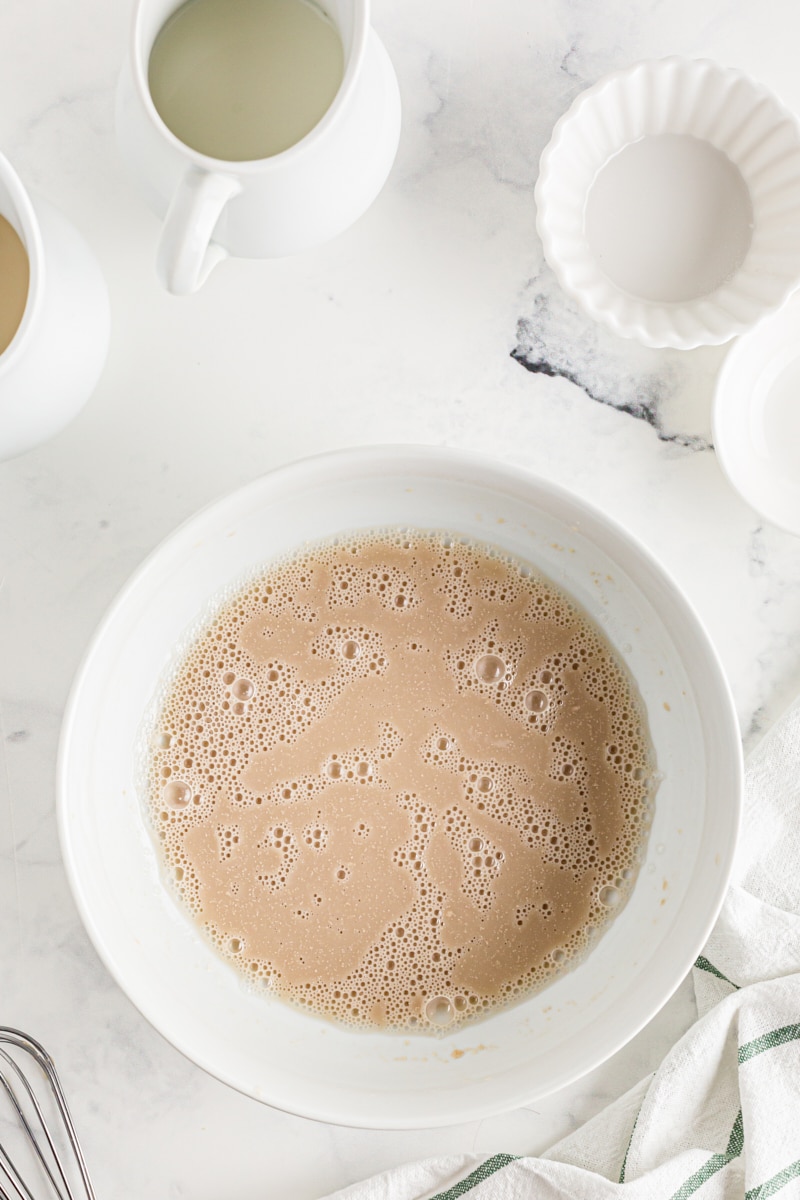 Yeast growing in water in a bowl on the counter.