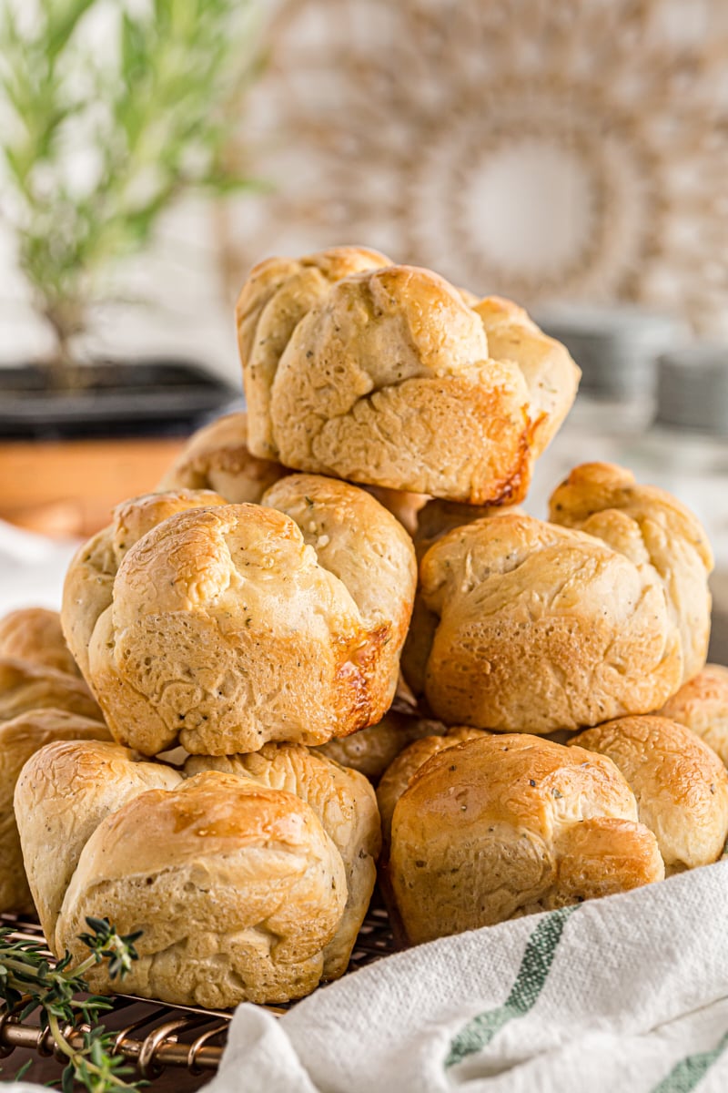 Herb Cloverleaf Rolls in a pile on the counter.